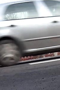 Black-haired Bitch Needs To Piss While Walking By A Road