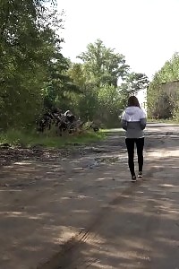 Brunette Lass Keeps A Lookout While Peeing