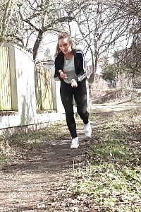 Naomi Benet Taking A Leek Near Abandoned Building
