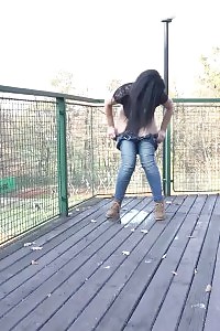 Dazzling Dark Haired Doll Pisses Over The Decking