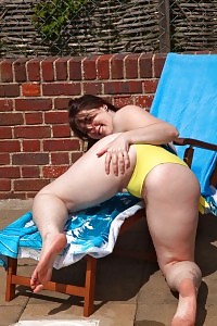 Blackhaired Girl Shows Her Sexy Black Pantiesand Legs As She Poses In Bed