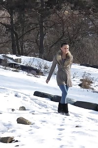 Black Haired Cutie Squats To Piss In The Snow