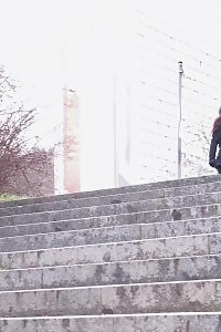 Black Haired Babe Pisses Down Concrete Steps