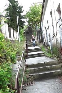 Blonde Honey Pissing On The Bottom Of Some Steps
