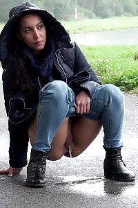 Impressive Black Haired Girl Pees On The Ground
