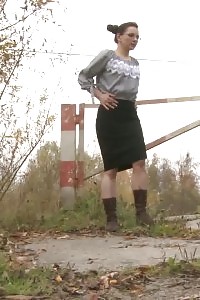 Black Haired Secretary Squats And Pissing Outside