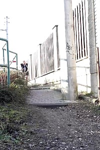 Light-haired Daisy Lee Taking A Leek Outside In The Woods