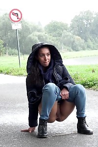 Impressive Black Haired Girl Pees On The Ground