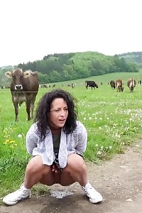 Black Haired Model Pisses On The Grass Outside