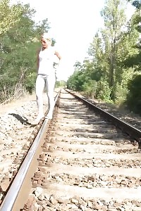 Flirtatious European Pisses Over The Railway Line