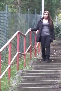 Outstanding Black-haired Gal Pisses On The Steps